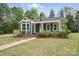 Charming home with navy blue siding, a front porch, and a well-maintained lawn at 410 E 17Th St, Kannapolis, NC 28083