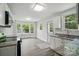 Bright kitchen with white cabinets, granite counters, stainless appliances, and a window at 410 E 17Th St, Kannapolis, NC 28083