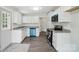 Renovated kitchen featuring stainless steel appliances, granite countertops, and white cabinetry at 410 E 17Th St, Kannapolis, NC 28083