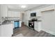 Modern kitchen features stainless steel appliances, granite countertops, and ample cabinet space at 410 E 17Th St, Kannapolis, NC 28083