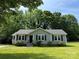 Charming single-story home with well-maintained landscaping at 5008 Delivau Dr, Charlotte, NC 28215