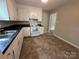 Spacious kitchen with ample counter space, double bowl sink, and white appliances in a convenient layout at 5008 Delivau Dr, Charlotte, NC 28215