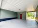 Spacious carport offering ample parking and featuring convenient access to the home's back entrance at 501 N Hawthorne St, Mount Holly, NC 28120