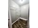 Walk-in closet features dark wood floor, metal shelving, and a hanging rod at 501 N Hawthorne St, Mount Holly, NC 28120