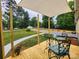 Inviting front porch offering an outdoor seating area with overhead awning and ample space for relaxing at 501 N Hawthorne St, Mount Holly, NC 28120