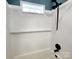 The walk-in shower features a sleek white tile surround, modern shower head, and glass door at 501 N Hawthorne St, Mount Holly, NC 28120