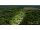 Wide aerial shot showing the property's location amid vast forested land at 6758 Zion Church Rd, Concord, NC 28025