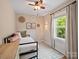 Cozy bedroom with comfortable bed, neutral décor, and natural light creates a peaceful and inviting retreat at 6758 Zion Church Rd, Concord, NC 28025