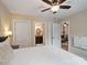 View from the cozy bedroom toward the closet and bathroom space, well-lit, with neutral walls at 6758 Zion Church Rd, Concord, NC 28025