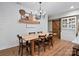 Rustic dining room with wooden table, modern chandelier and shiplap accent wall at 6758 Zion Church Rd, Concord, NC 28025