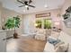 Cozy living room with light-filled windows, hardwood floors, and comfortable seating, creating a welcoming atmosphere at 6758 Zion Church Rd, Concord, NC 28025