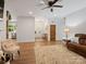 Open-concept living space with hardwood floors and views into the kitchen at 6758 Zion Church Rd, Concord, NC 28025
