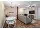 Bright living room features hardwood floors, ceiling fan, and cozy seating area, perfect for relaxing and entertaining at 6758 Zion Church Rd, Concord, NC 28025
