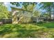 The home has a screened-in back porch and large backyard with room to roam at 6807 Woodfield Dr, Charlotte, NC 28215