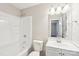 Bathroom featuring shower over tub combination with a white single sink vanity at 6807 Woodfield Dr, Charlotte, NC 28215
