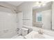 Bright bathroom with white tiled shower, tub combination, and vanity at 6807 Woodfield Dr, Charlotte, NC 28215