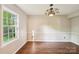 Bright dining room with wood floors, chandelier, and large window providing ample natural light at 6807 Woodfield Dr, Charlotte, NC 28215