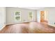 Spacious room with hardwood floors, ample natural light, and convenient electrical outlets at 6807 Woodfield Dr, Charlotte, NC 28215