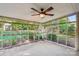 Spacious sunroom with a fan and a view of the backyard at 6807 Woodfield Dr, Charlotte, NC 28215