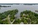 An aerial shot capturing a stunning waterfront community with lush greenery and private docks along the serene lake at 7471 Barfield Ln, Denver, NC 28037