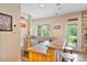 This room features a bar area with seating, sink, dishwasher, storage, and backyard access at 7471 Barfield Ln, Denver, NC 28037