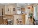 Finished basement features a bar area, complete with stools, sink, mini fridge and hanging cabinets at 7471 Barfield Ln, Denver, NC 28037