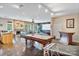 Finished basement with a stone fireplace, a pool table, a bar area, and ample entertainment space at 7471 Barfield Ln, Denver, NC 28037