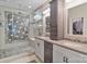Bathroom showcasing a glass shower, double sink vanity, and custom storage, offering a luxurious and functional space at 7471 Barfield Ln, Denver, NC 28037