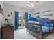 Cozy bedroom with nautical decor, a crib with canopy, and access to a balcony, creating a charming retreat at 7471 Barfield Ln, Denver, NC 28037