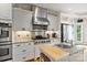 Kitchen features modern appliances, granite countertops, and a sink island at 7471 Barfield Ln, Denver, NC 28037