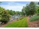 Picturesque lake view with a walkway leading to a private dock at 7471 Barfield Ln, Denver, NC 28037