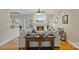 Living room featuring fireplace, hardwood floors, and comfortable seating at 7471 Barfield Ln, Denver, NC 28037