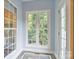 Inviting sunroom filled with natural light from the many windows that provide peaceful views of the outdoors at 7471 Barfield Ln, Denver, NC 28037