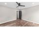 Bedroom with a ceiling fan, wood-look floors, baseboard trim and neutral paint at 750 Whites Farm Rd, Statesville, NC 28625