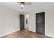Bedroom with modern doors and wood-look flooring, creating a cozy and stylish space at 750 Whites Farm Rd, Statesville, NC 28625