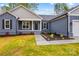 Close-up of a well-maintained home's front entrance with a landscaped walkway and modern exterior at 750 Whites Farm Rd, Statesville, NC 28625