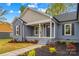 Inviting front entrance of a home with manicured landscaping and a welcoming porch at 750 Whites Farm Rd, Statesville, NC 28625