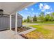 View from the covered front porch, highlighting the landscaped yard and neighborhood at 750 Whites Farm Rd, Statesville, NC 28625