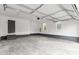 Spacious garage with high ceilings, painted walls, and natural light from multiple windows at 750 Whites Farm Rd, Statesville, NC 28625