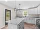 Stylish kitchen featuring an island, granite countertops, stainless appliances and plenty of storage at 750 Whites Farm Rd, Statesville, NC 28625