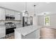 Stylish kitchen showcasing stainless steel appliances, granite countertops, and a center island at 750 Whites Farm Rd, Statesville, NC 28625