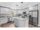 Modern kitchen featuring granite countertops, stainless steel appliances, and a center island at 750 Whites Farm Rd, Statesville, NC 28625