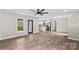Open-concept living area with a view into the kitchen, showcasing new flooring and fixtures at 750 Whites Farm Rd, Statesville, NC 28625