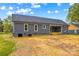 Back view of the house, featuring clean lines, and a covered porch at 750 Whites Farm Rd, Statesville, NC 28625