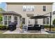 Backyard patio area with lounge furniture, an outdoor grill and a well maintained lawn at 8200 Sunset Hill Rd, Waxhaw, NC 28173