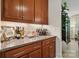Dry bar features granite countertops, sleek cabinets, and a built-in wine rack, perfect for entertaining guests at 8200 Sunset Hill Rd, Waxhaw, NC 28173