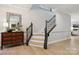 Elegant foyer with hardwood floors, staircase and decorative mirror at 8200 Sunset Hill Rd, Waxhaw, NC 28173