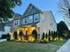 Exterior dusk view of home with manicured landscaping and an illuminated front porch at 8200 Sunset Hill Rd, Waxhaw, NC 28173