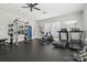 Well-equipped gym features weight machines, treadmill and ceiling fan at 8200 Sunset Hill Rd, Waxhaw, NC 28173