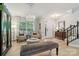 Bright and airy living room with a chandelier and bench seating at 8200 Sunset Hill Rd, Waxhaw, NC 28173